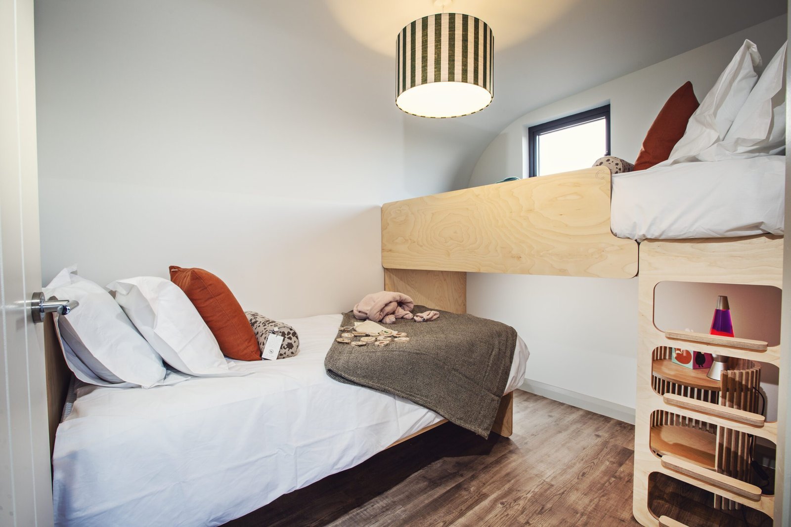 Cozy bunk bed setup in a modern cabin bedroom