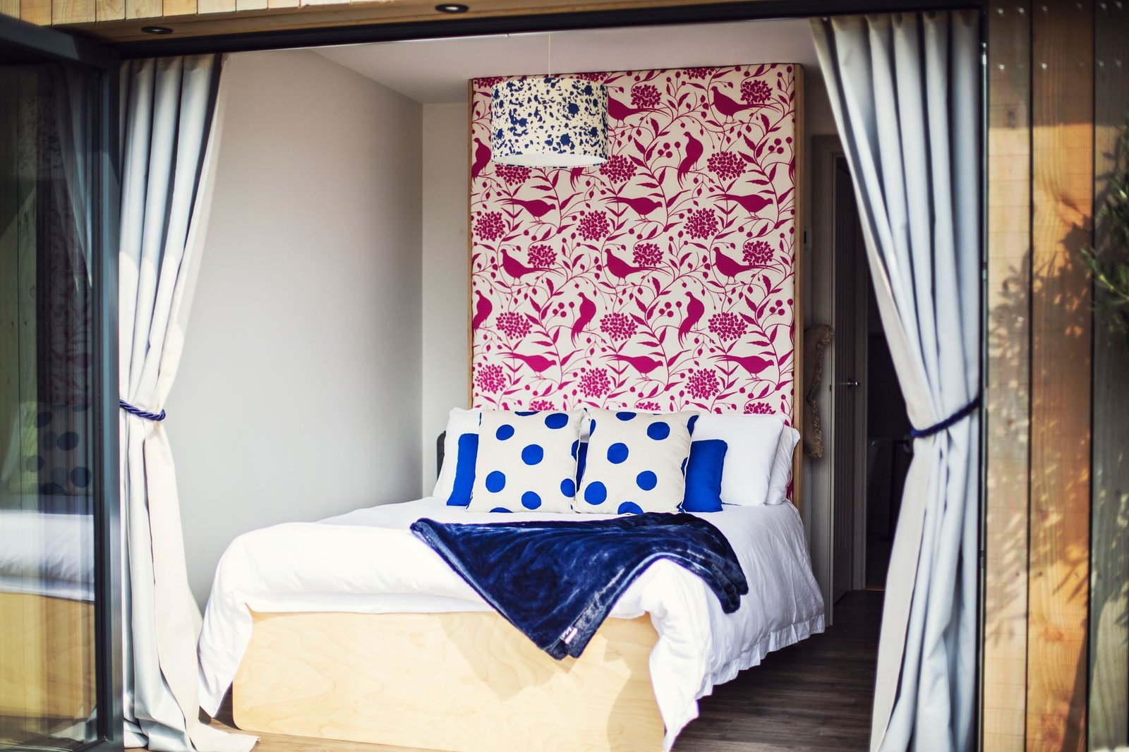 Double bedroom with blue and pink accents at The Meadow